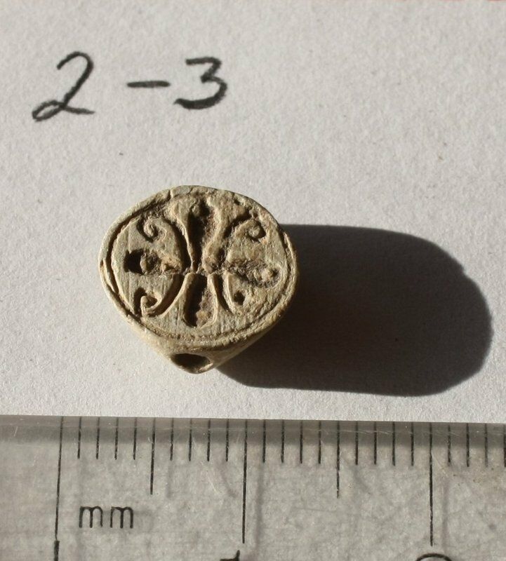An Ancient Egyptian Bead with Carved Scroll Pattern